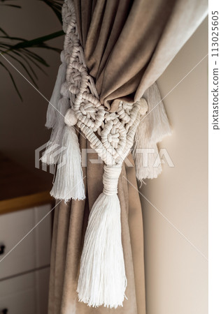 curtain tieback in boho style in interior 113025605