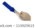 Hand holding paint brush blue on a white background 113025613