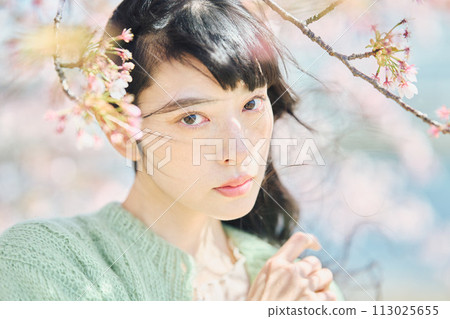 Portrait of a beautiful woman with cherry blossoms Portrait of a beautiful woman with cherry blossoms 113025655