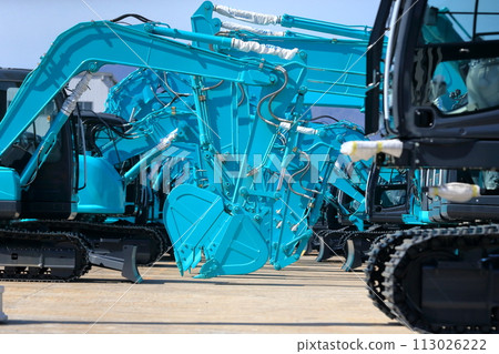 excavator cars lined up excavator cars lined up 113026222