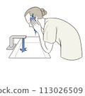 Middle-aged woman washing her face 113026509