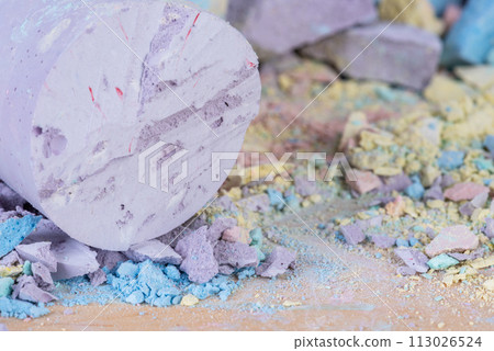 Crumbs and pieces of pastel chalk close-up view Crumbs and pieces of pastel chalk close-up view 113026524