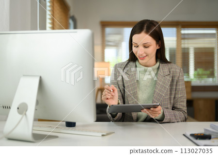 Successful caucasian businesswoman using digital tablet working remotely from home 113027035
