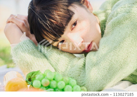 A woman enjoying a picnic 113027185