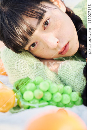 A woman enjoying a picnic A woman enjoying a picnic 113027188