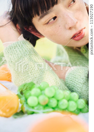 A woman enjoying a picnic A woman enjoying a picnic 113027190