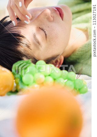 A woman enjoying a picnic A woman enjoying a picnic 113027191