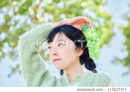A woman with fruit A woman with fruit 113027371