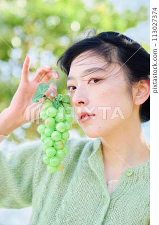 A woman with fruit A woman with fruit 113027374