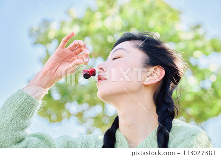 A woman with fruit A woman with fruit 113027381