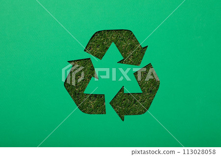 Material recycling sign on a green background Material recycling sign on a green background 113028058