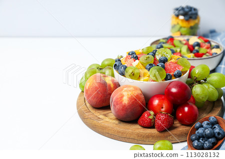 Tasty and healthy nutrition concept - fruit salad 113028132