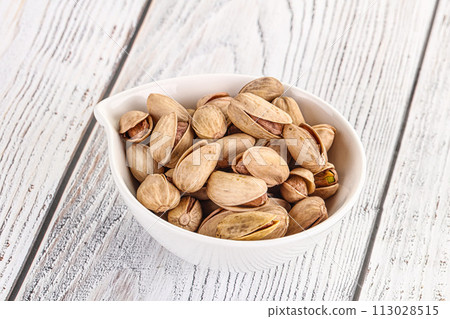 Salted tasty pistachio nuts heap Salted tasty pistachio nuts heap 113028515