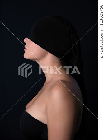 Abstract Portrait of Woman with Black Cloth on Dark Background Abstract Portrait of Woman with Black Cloth on Dark Background 113028756