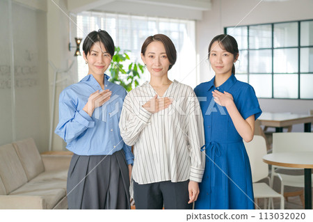 women putting their hands on their chest 113032020