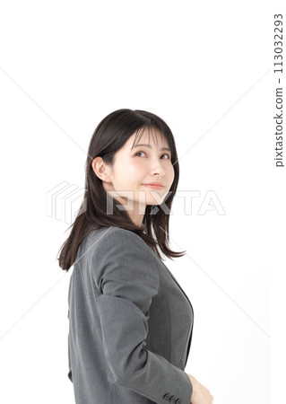 Business woman turning around with a smile 113032293