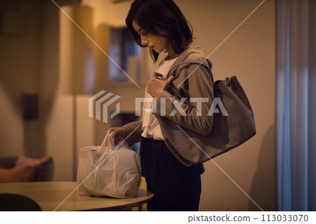 Night routine of a business woman putting ingredients on the table 113033070
