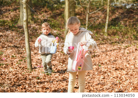 The kids looking for eggs in a bag for Easter 113034050