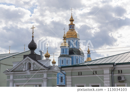 [Ukraine] Golden and light blue exterior of the Virgin Mary Monastery and cloudy sky in Kharkiv 113034103