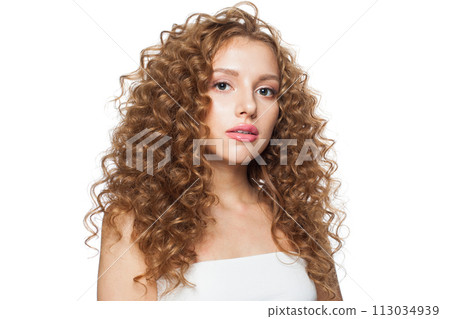 Elegant woman face. Young model with healthy skin, long hair and makeup on white background Elegant woman face. Young model with healthy skin, long hair and makeup on white background 113034939