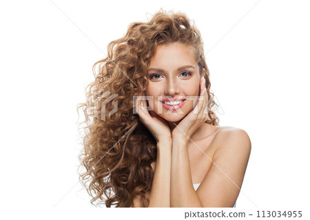 Redhead woman face. Young model with healthy skin, long hair and makeup on white background 113034955