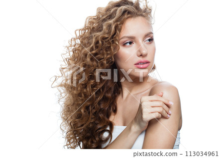 Gorgeous good-looking redhead woman with clean skin, curly hairstyle and natural make-up.  113034961