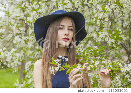 Elegant brunette woman portrait. Beautiful female model with long hair and make-up Elegant brunette woman portrait. Beautiful female model with long hair and make-up 113035001