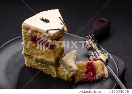 Delicious sweet dessert cheesecake with raspberry and pistachio flavor 113035096