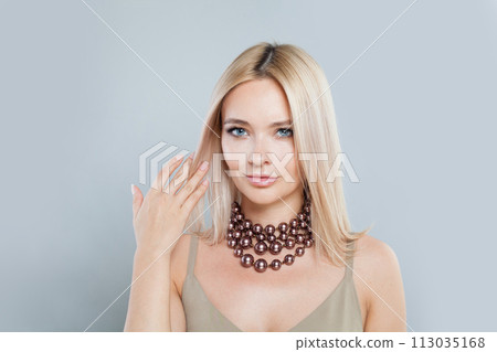 Perfect young blonde lady with fresh clear skin and long smooth straight hairstile  113035168