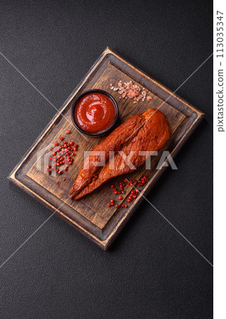 Delicious smoked meat chicken breast with salt, spices and herbs 113035347