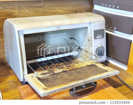 Toaster oven with heavy oil stains 113035849