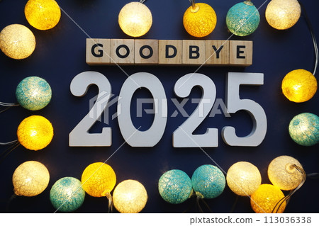 Goodbye 2025 alphabet letter with cotton ball LED decoration on blue background Goodbye 2025 alphabet letter with cotton ball LED decoration on blue background 113036338