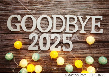 Goodbye 2025 alphabet letter with cotton ball LED decoration on wooden background Goodbye 2025 alphabet letter with cotton ball LED decoration on wooden background 113036339