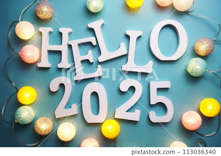 Hello 2025 alphabet letter with cotton ball LED decoration on blue background Hello 2025 alphabet letter with cotton ball LED decoration on blue background 113036340