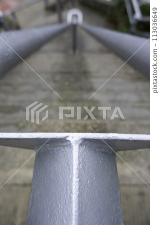 Detail of a railing on a staircase in the street Detail of a railing on a staircase in the street 113036649