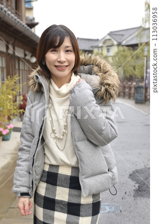 Portrait of a young woman posing on the streets of Sawara 113036958