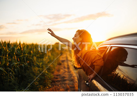Towards adventure! Woman is resting and enjoying trip in car. Lifestyle, travel, tourism, nature. Towards adventure! Woman is resting and enjoying trip in car. Lifestyle, travel, tourism, nature. 113037035