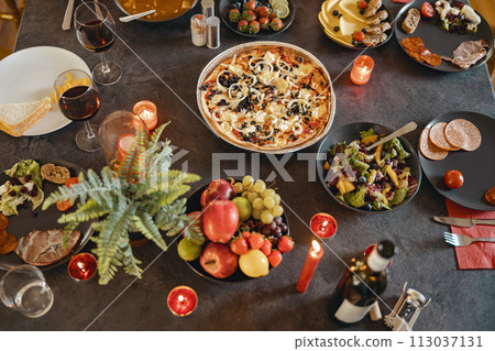 Top view of holiday table with tasty delicious food and beverages ready for home dinner 113037131