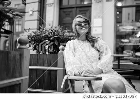 Young Woman chilling in cozy cafe, looking around , happy emotions. Traveling woman. 113037387