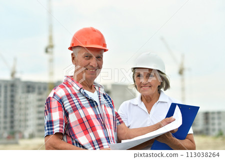 Portrait of senior couple in under construction Portrait of senior couple in under construction 113038264