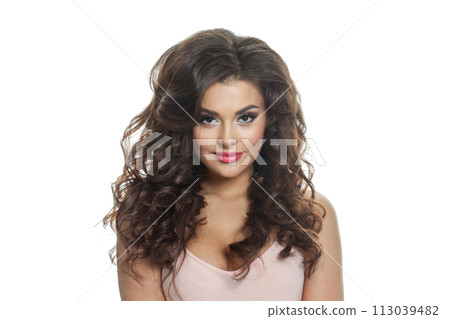 Healthy brunette female model with long wavy hair, makeup and cute smile looking at camera Healthy brunette female model with long wavy hair, makeup and cute smile looking at camera 113039482