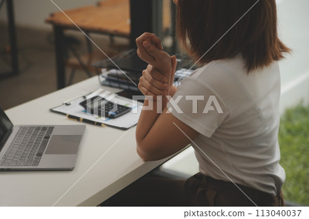 Shot of a asian young business Female working on laptop in her workstation. 113040037