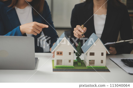 Business Signing a Contract Buy - sell house, insurance agent analyzing about home investment loan Real Estate concept. Business Signing a Contract Buy - sell house, insurance agent analyzing about home investment loan Real Estate concept. 113040064