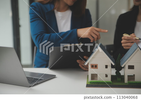Business Signing a Contract Buy - sell house, insurance agent analyzing about home investment loan Real Estate concept. 113040068