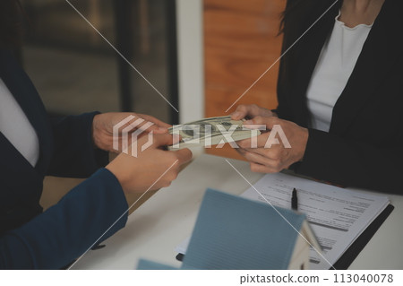 Business Signing a Contract Buy - sell house, insurance agent analyzing about home investment loan Real Estate concept. 113040078