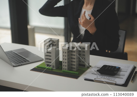 Business Signing a Contract Buy - sell house, insurance agent analyzing about home investment loan Real Estate concept. Business Signing a Contract Buy - sell house, insurance agent analyzing about home investment loan Real Estate concept. 113040089