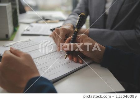 Business Signing a Contract Buy - sell house, insurance agent analyzing about home investment loan Real Estate concept. 113040099