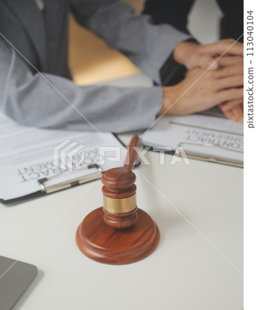 Lawyer, legal advisor, businessman brainstorming information on agreement details Business contracts in legal processing books for accuracy in contract documents. joint financial investment. 113040104