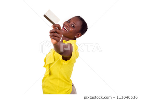 Happy woman holding a credit card 113040536