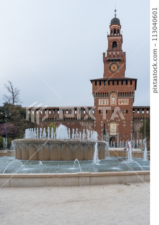 Sforzesco castle and fountain at overcast day Sforzesco castle and fountain at overcast day 113040601